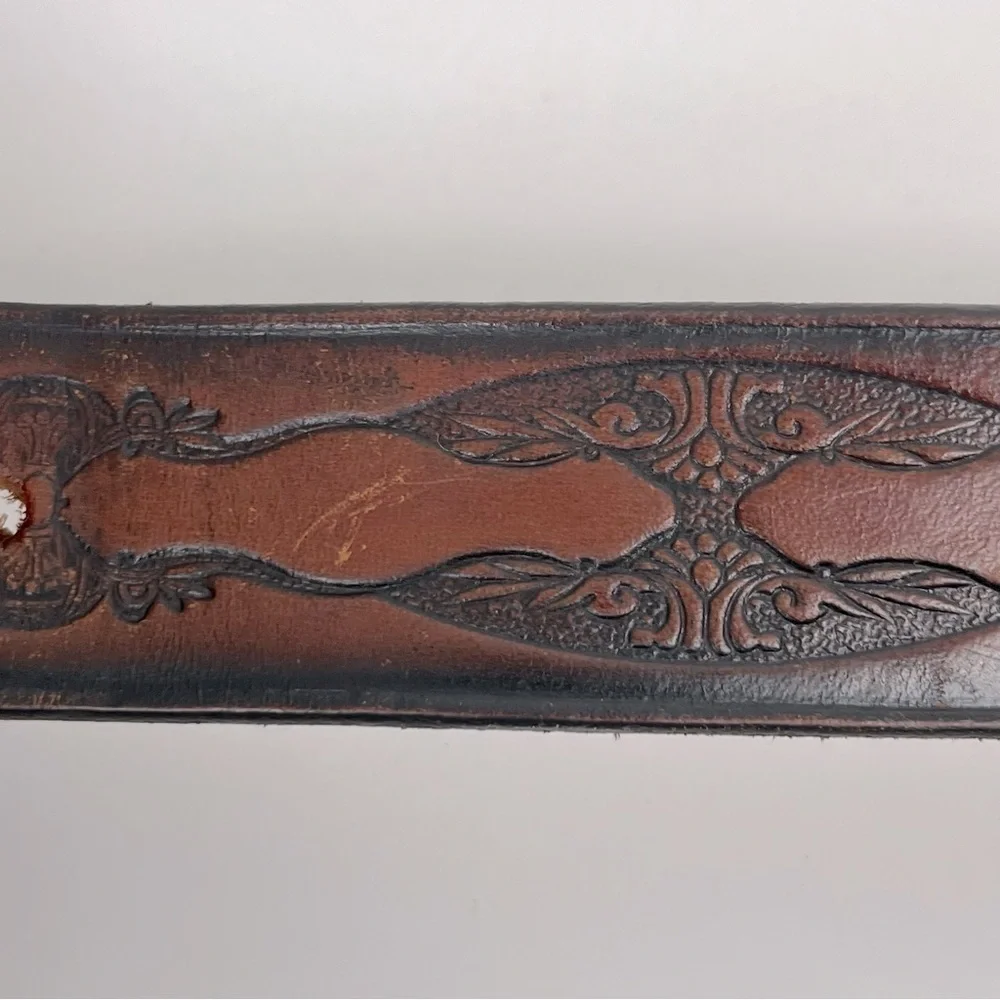 Brown tooled leather belt, unisex, approximately 34” see measurements in photos.